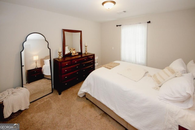 bedroom with carpet and visible vents