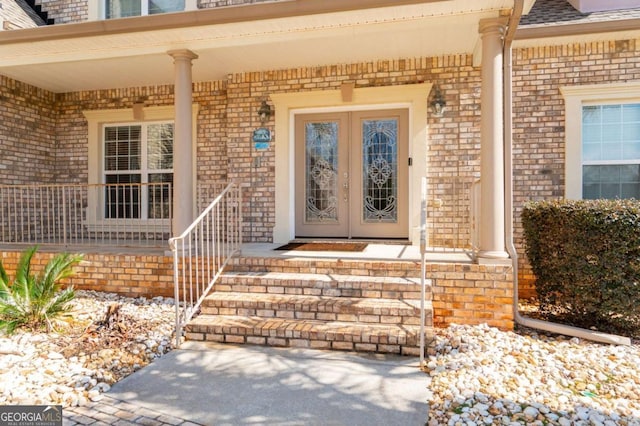 entrance to property with french doors and brick siding