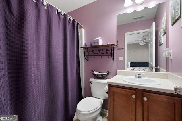 bathroom with visible vents, vanity, toilet, and ensuite bathroom
