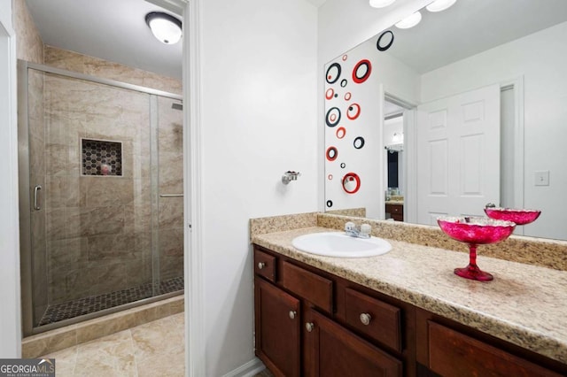 full bath featuring a stall shower and vanity