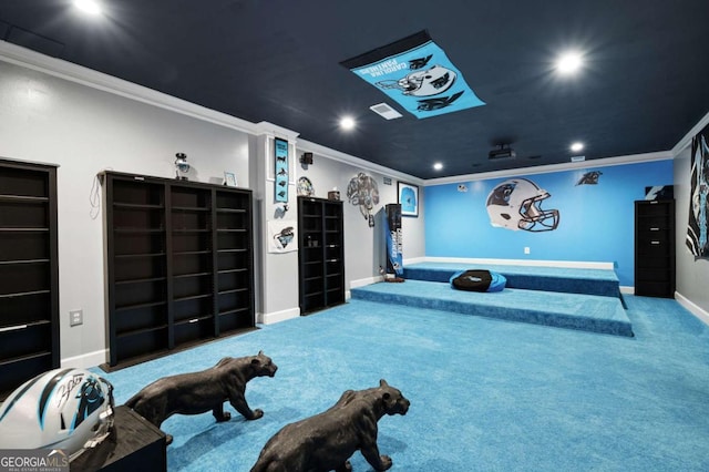 carpeted cinema room with ornamental molding, recessed lighting, and baseboards