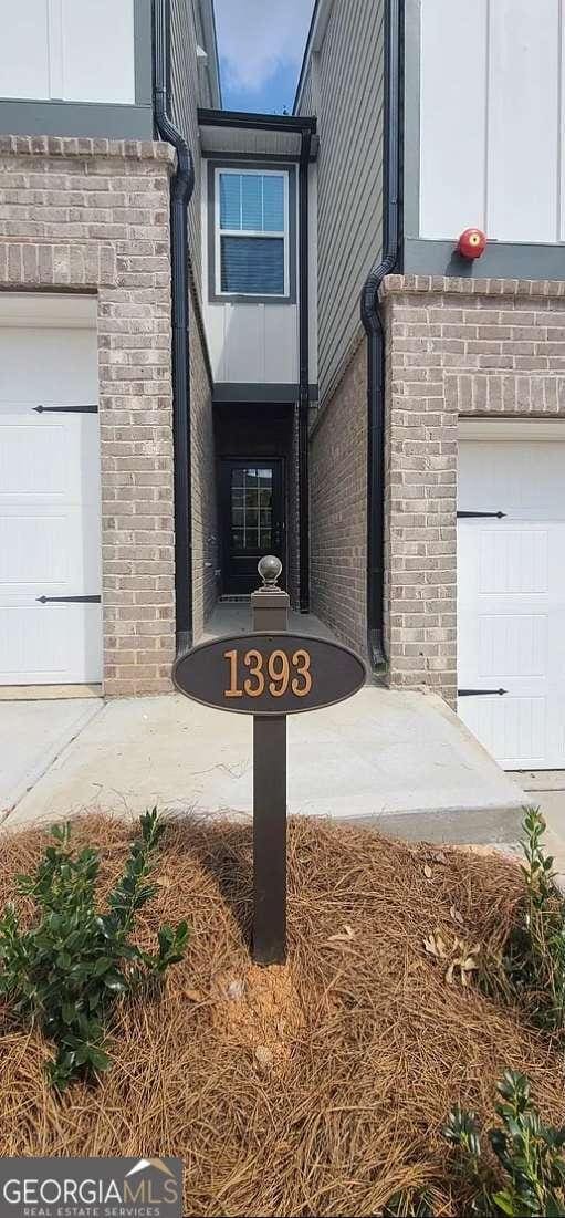 property entrance with brick siding