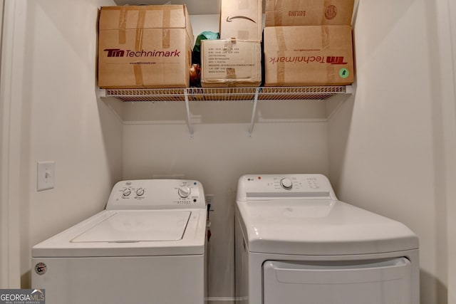 laundry area featuring laundry area and washer and clothes dryer