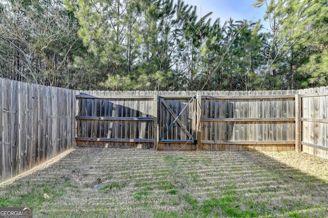 view of yard with a fenced backyard