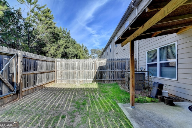 view of yard featuring a patio area and a fenced backyard