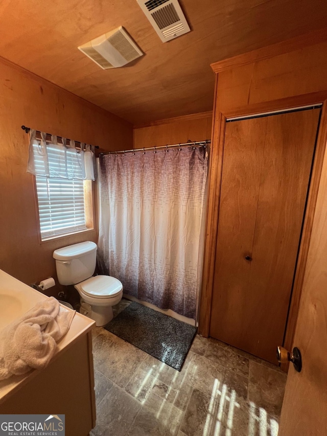 bathroom with toilet, wood ceiling, vanity, and visible vents