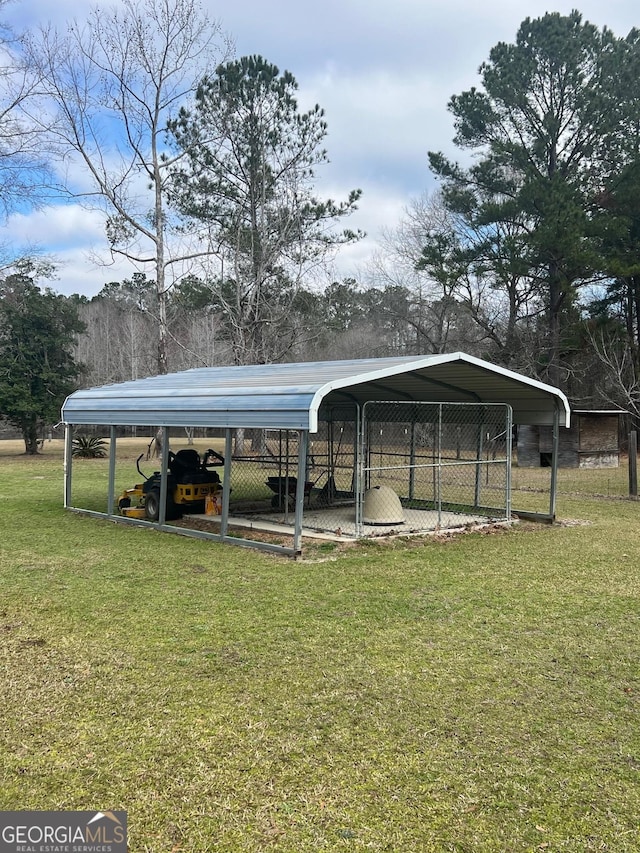 view of property's community with a carport and a yard