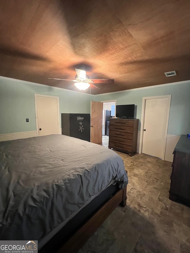 bedroom with wooden ceiling, visible vents, and a ceiling fan