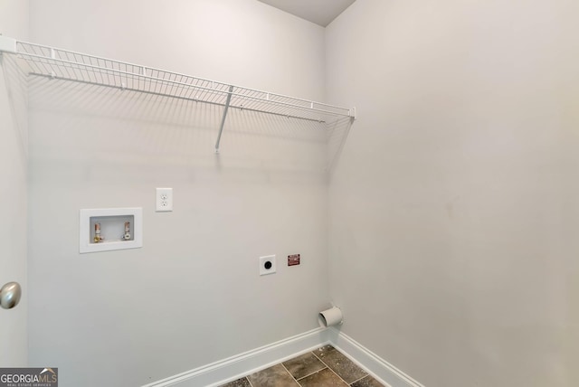 laundry area with laundry area, hookup for a washing machine, baseboards, and electric dryer hookup