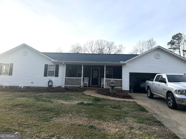 single story home featuring a garage, a front lawn, a porch, and concrete driveway