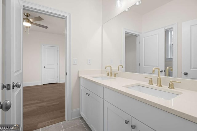 full bath featuring ceiling fan, tile patterned flooring, a sink, and double vanity