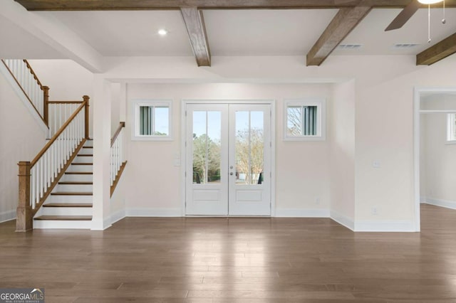 entryway featuring dark wood-style floors and beamed ceiling