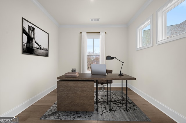 office space with baseboards, crown molding, visible vents, and dark wood-type flooring