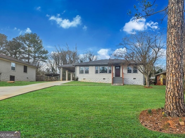 ranch-style home with an attached carport, crawl space, driveway, and a front lawn