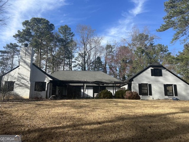 view of property exterior featuring a yard and brick siding