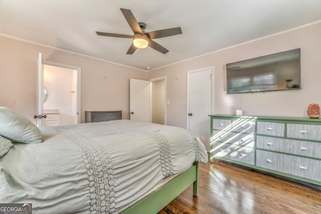bedroom with wood finished floors, a ceiling fan, and crown molding