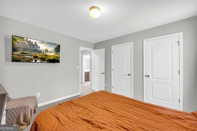 bedroom with carpet floors and baseboards