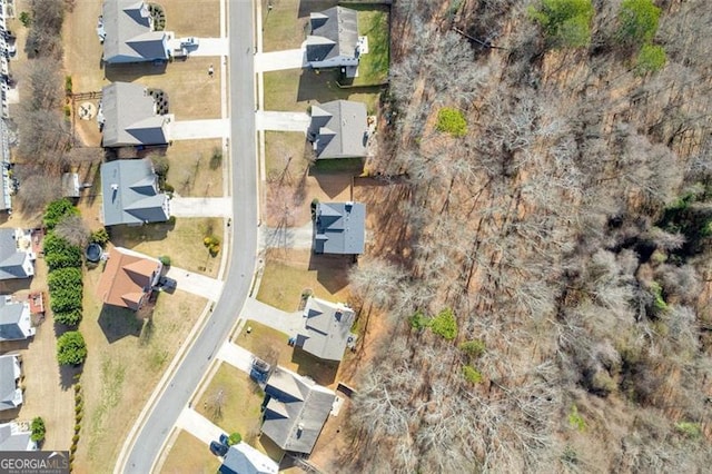 birds eye view of property with a residential view