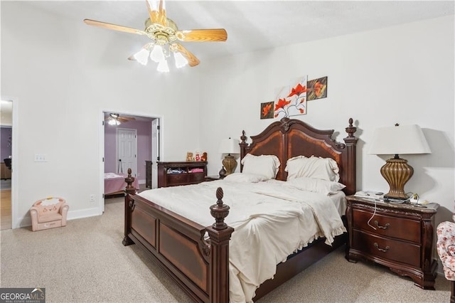 bedroom with baseboards, a ceiling fan, and light colored carpet