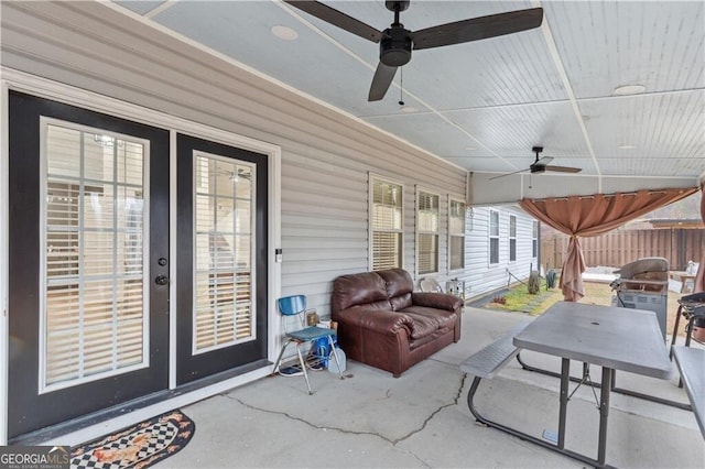 view of patio / terrace featuring a ceiling fan and fence