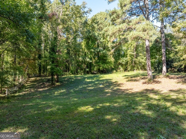 view of yard with a forest view