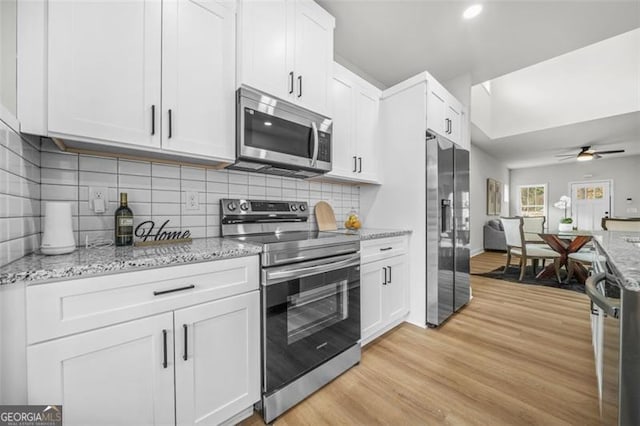 395 Lake Ave, Atlanta, GA 30318 - kitchen with white cabinets, appliances with stainless steel finishes, and a ceiling fan
