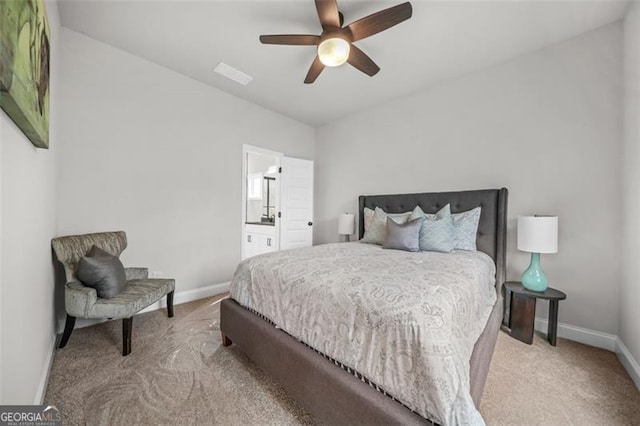 395 Lake Ave, Atlanta, GA 30318 - carpeted bedroom featuring a ceiling fan, baseboards, and ensuite bathroom