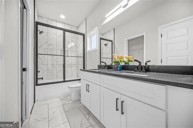395 Lake Ave, Atlanta, GA 30318 - full bathroom featuring marble finish floor, a sink, shower / bath combination with glass door, and double vanity