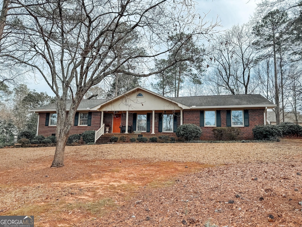 ranch-style home with brick siding