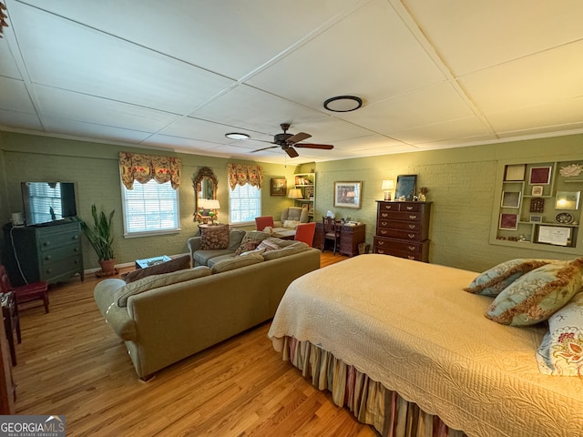 bedroom featuring wood finished floors and a ceiling fan