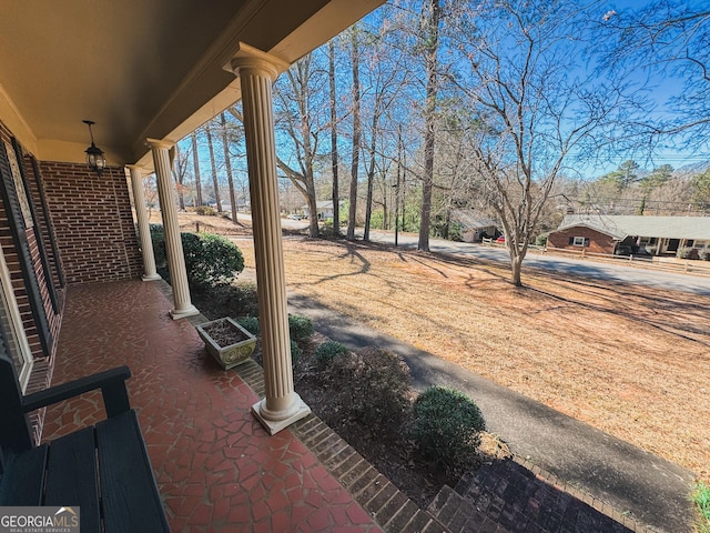 view of yard featuring covered porch