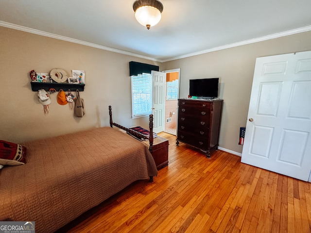 bedroom with light wood-style flooring, ornamental molding, and baseboards