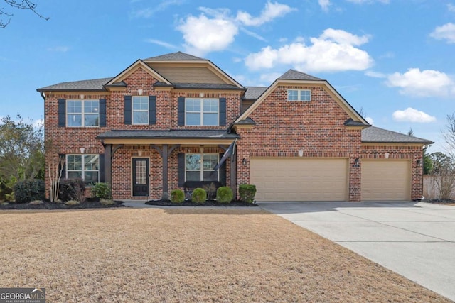 view of front of property with driveway, brick siding, and an attached garage