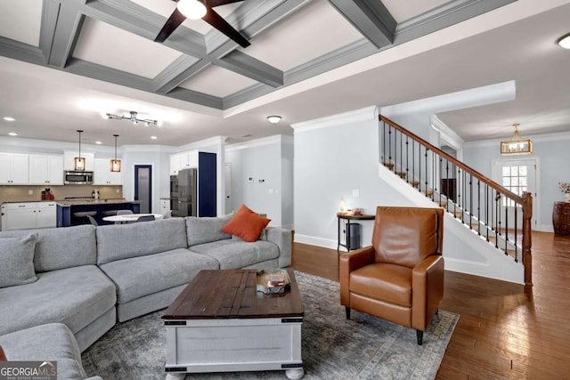 living area with dark wood-type flooring, coffered ceiling, beamed ceiling, and stairway