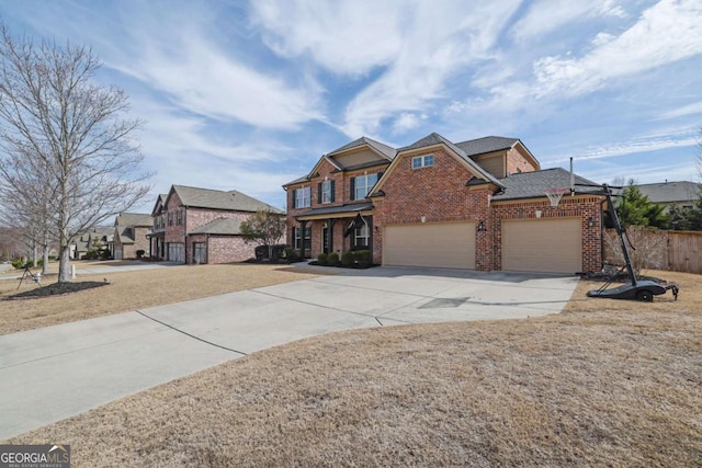 view of front of home featuring driveway, an attached garage, a front lawn, and brick siding