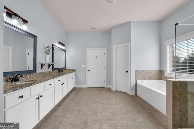 full bath with double vanity, visible vents, a sink, tile patterned flooring, and a bath