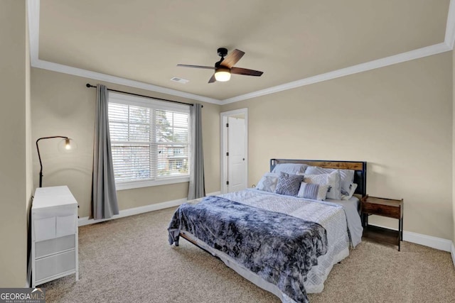 bedroom featuring carpet floors, a ceiling fan, baseboards, and crown molding