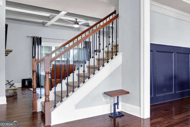 stairway featuring a ceiling fan, wood finished floors, coffered ceiling, beamed ceiling, and baseboards