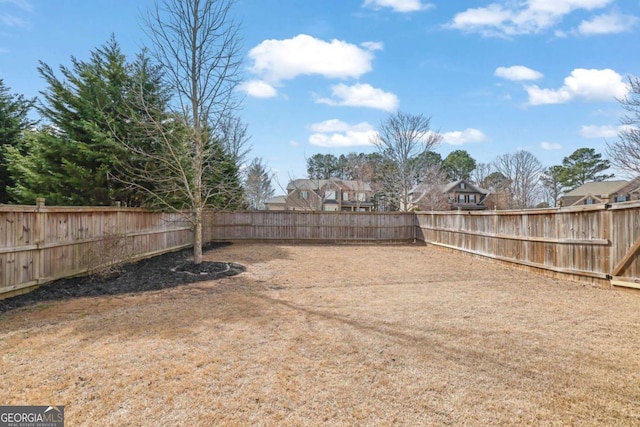 view of yard featuring a fenced backyard