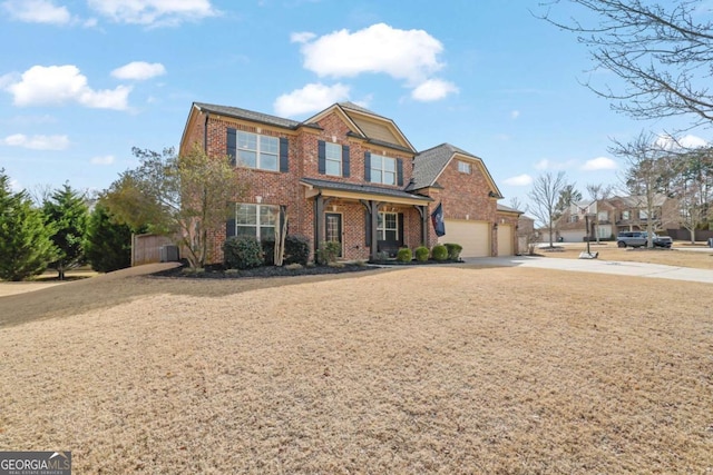 view of front of home featuring a porch, brick siding, driveway, and an attached garage