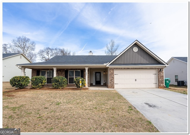 ranch-style home featuring a garage, brick siding, concrete driveway, a front lawn, and board and batten siding