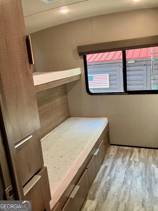 unfurnished bedroom featuring light wood-style flooring