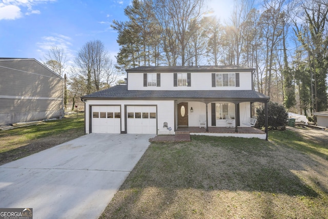 view of front of property with covered porch, driveway, a front yard, and a garage