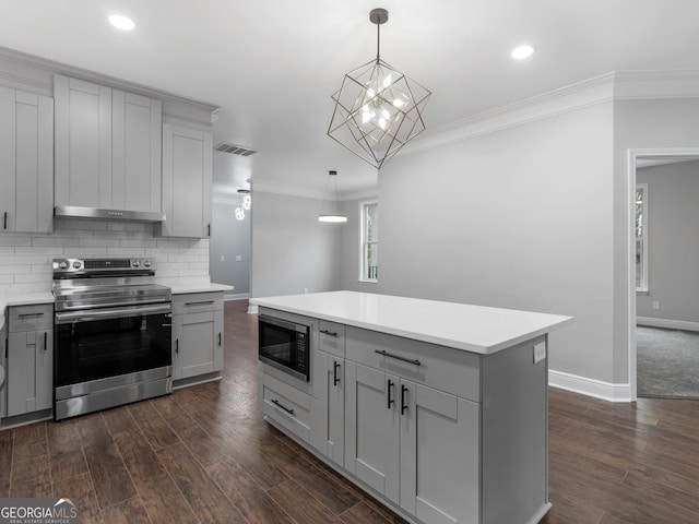 kitchen with electric stove, pendant lighting, gray cabinets, light countertops, and built in microwave