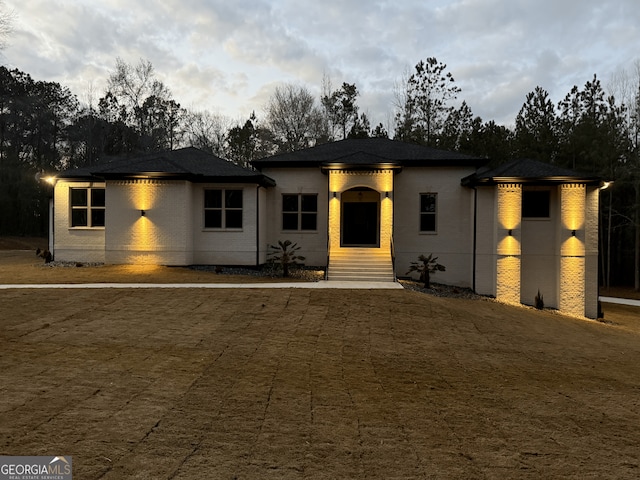 prairie-style home with brick siding