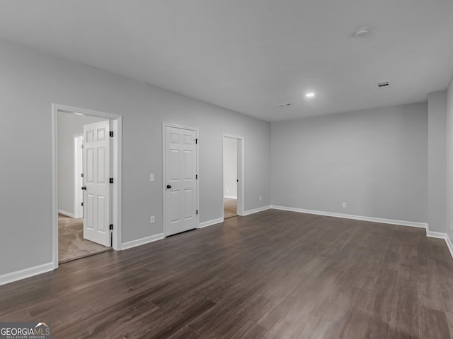 interior space with recessed lighting, dark wood-style flooring, and baseboards