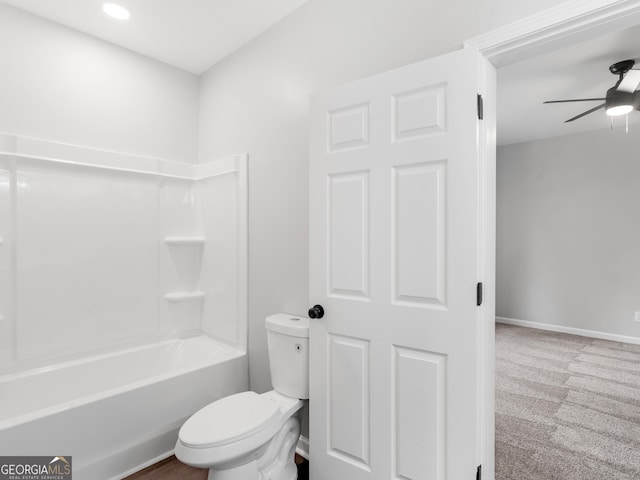 full bath with toilet, baseboards, a ceiling fan, and shower / bathing tub combination