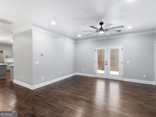 unfurnished living room featuring baseboards, dark wood-style flooring, visible vents, and crown molding