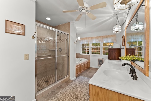 full bath with double vanity, tile patterned floors, a sink, a shower stall, and a bath