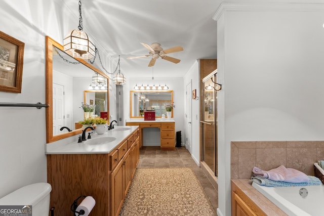 bathroom with a garden tub, toilet, a ceiling fan, a stall shower, and vanity